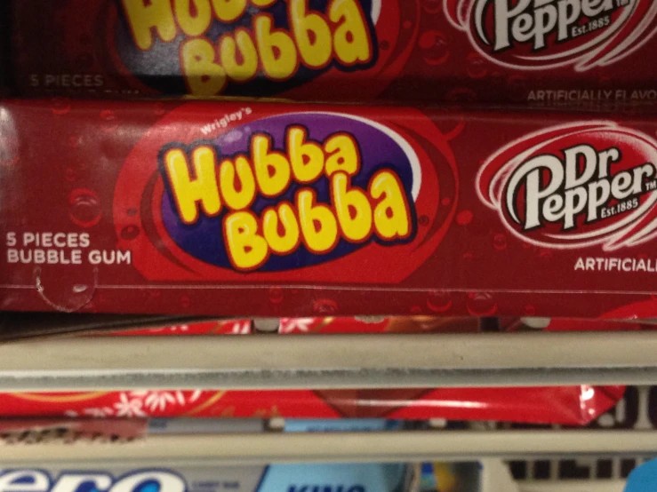 several rolls of bubble bubble soda in a store