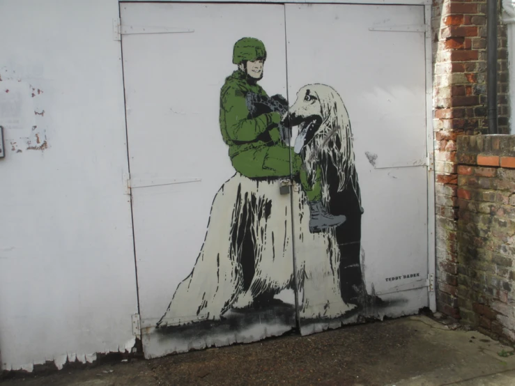 a painting on a wall shows a man in uniform with a dog