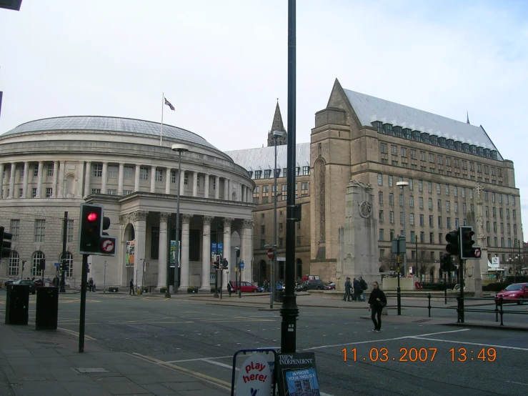 a street corner in front of a large building