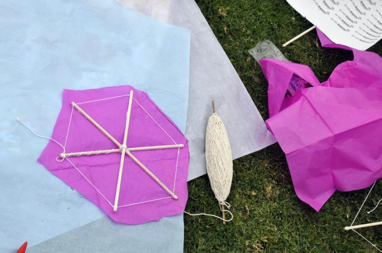 some paper and craft tools sitting on the ground