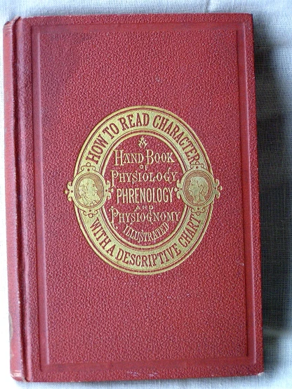 red book with golden trim on a white cloth