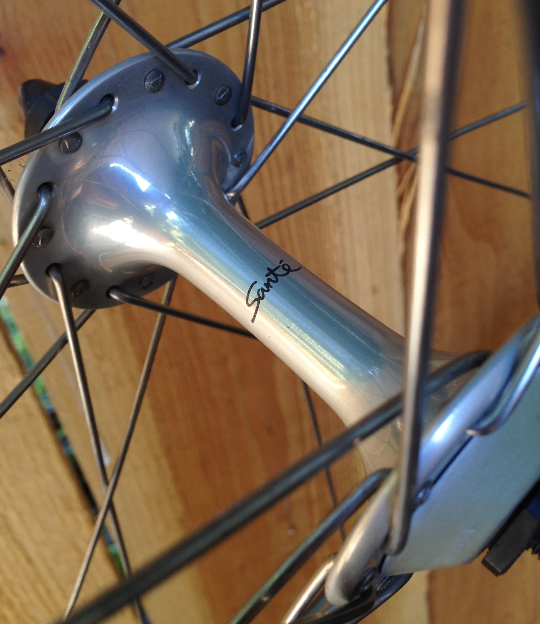 a bicycle wheel has been scratched with a paint job