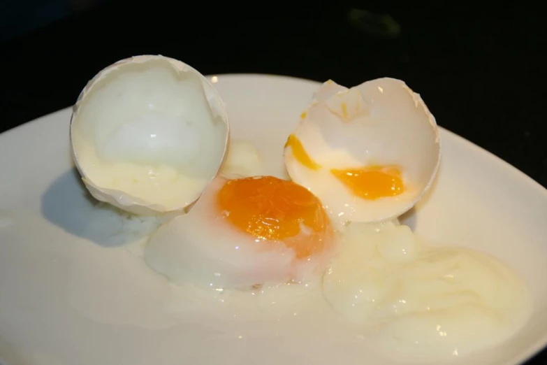 two halves of an egg on a plate