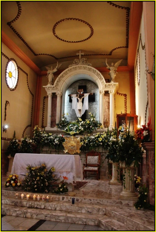 a room that has flowers and candles in it