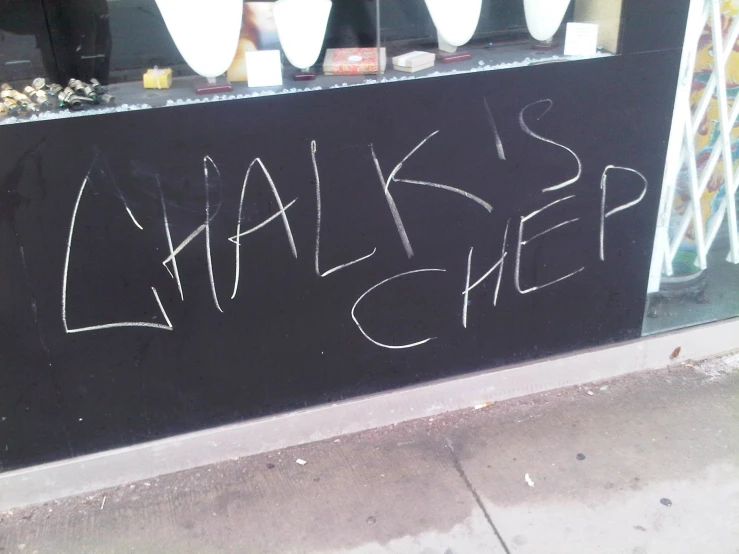a chalkboard on the outside of a bar reads knak's sleep