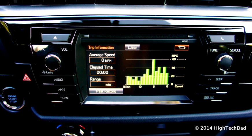 a view of the dashboard and instrument screen of an automobile