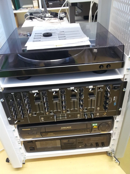 a group of different looking stereo equipment stacked up