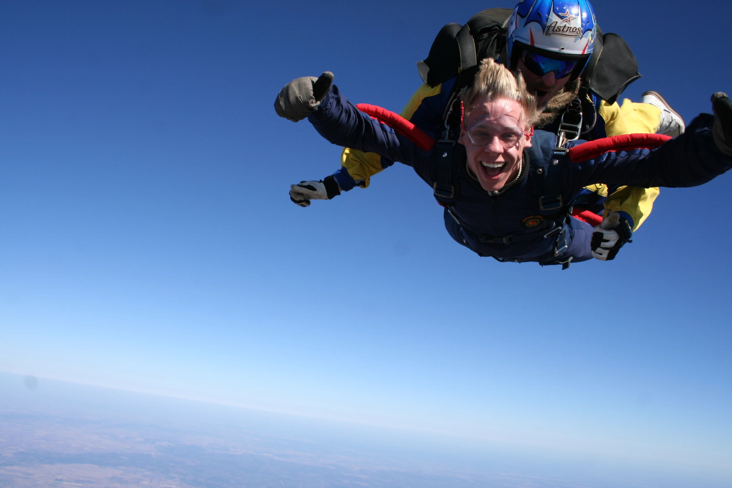 a person on a pair of parachutes, skydiving