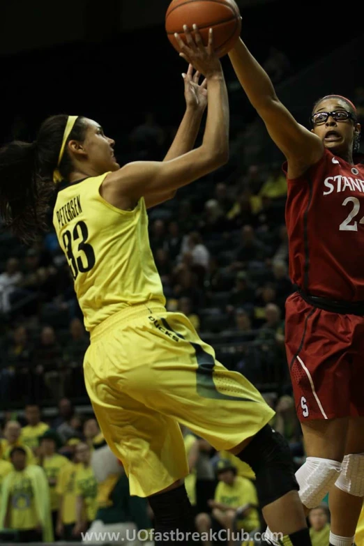 girls basketball game action during a stadium style arena