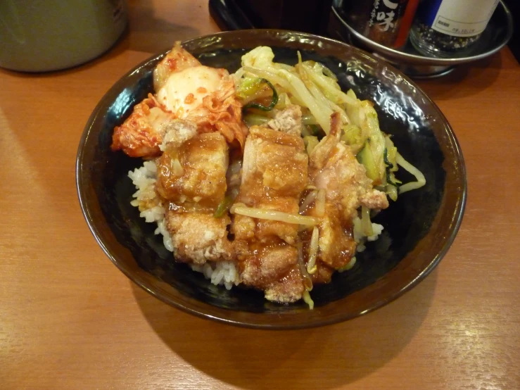 the meal is prepared on the table with two beer mugs nearby