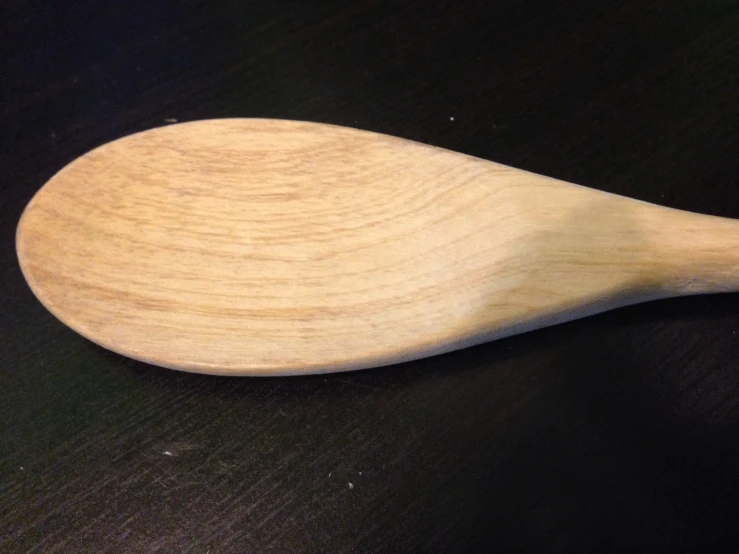 a close up view of a wooden spoon