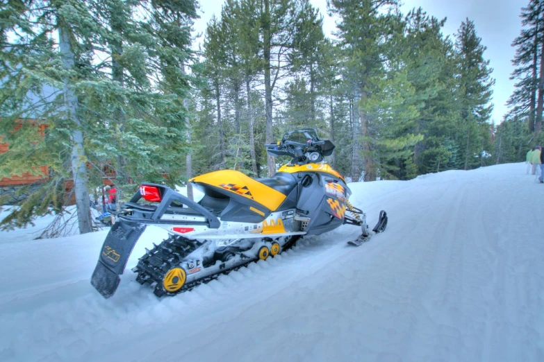 a person riding on the back of a snowmobile