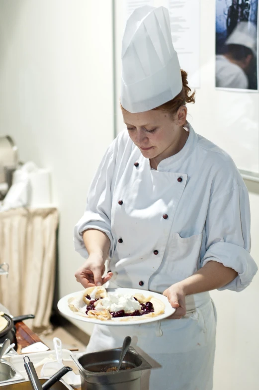 a chef prepares to serve some sort of dessert