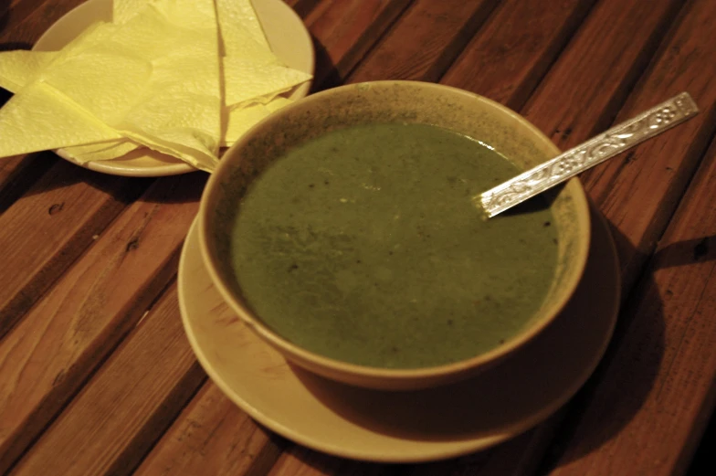 the soup is in a bowl with a spoon in it