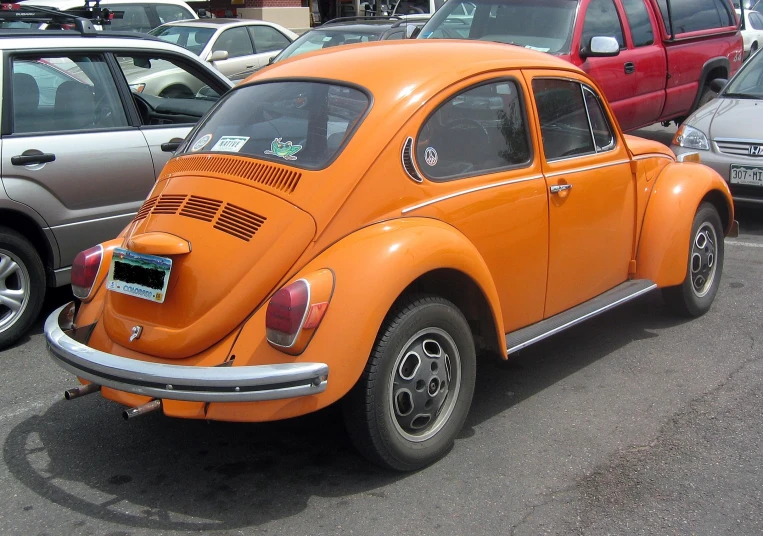 the orange beetle is in a parking space