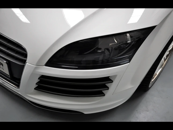 the front bumper of a white car