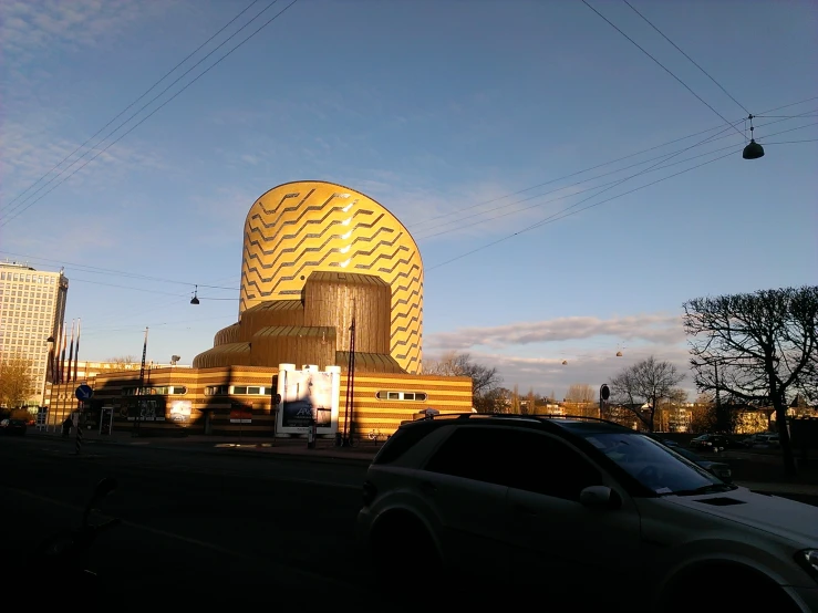 an unusual building has an ornately shaped dome