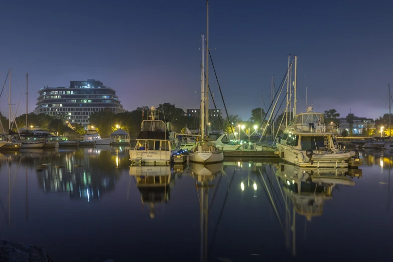 several boats are anchored together in the water