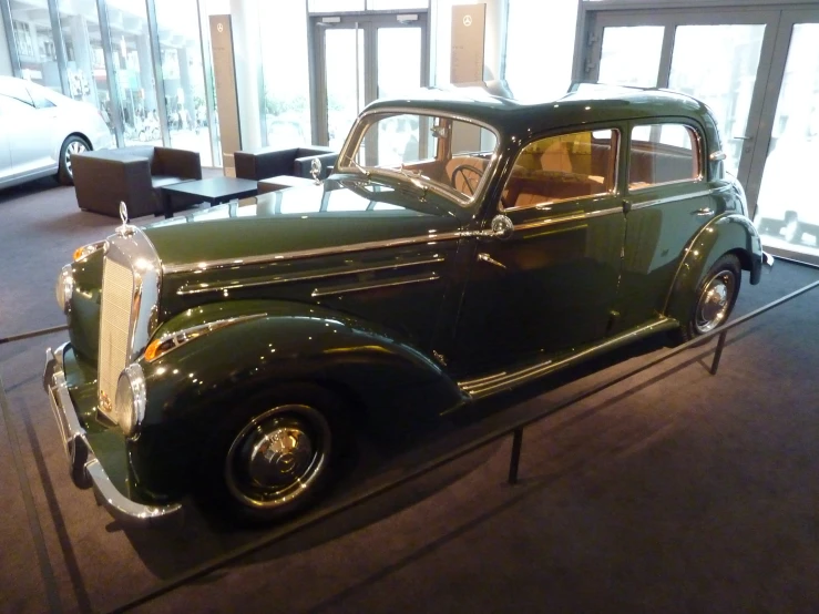 a vehicle is sitting on display in a building