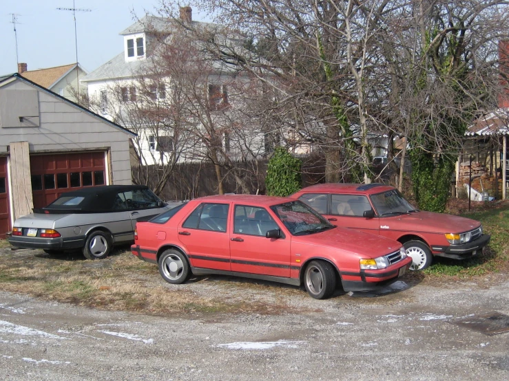 two red cars parked next to each other