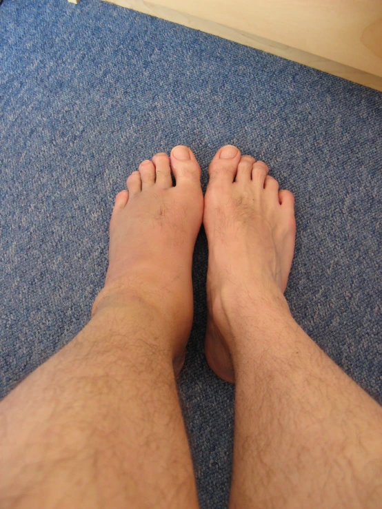 the bottom view of a man's bare feet