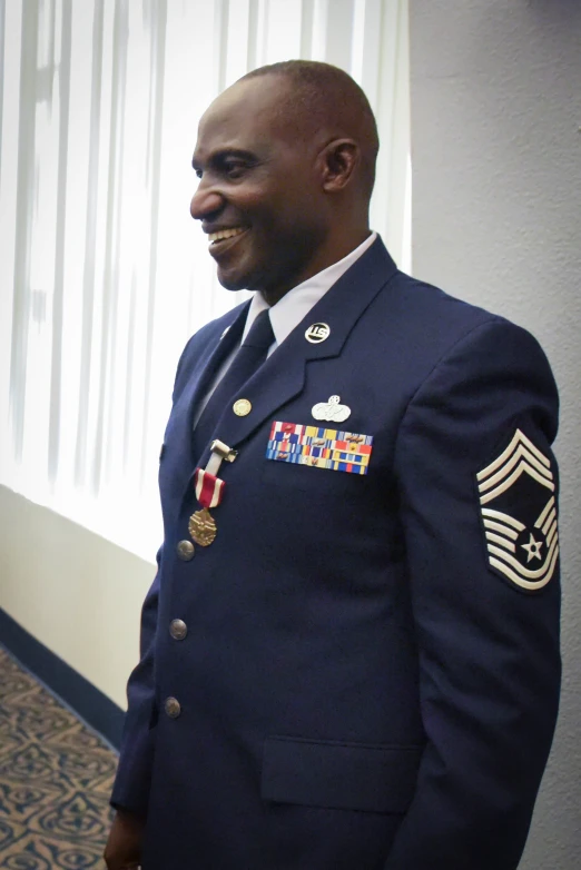 a close up of a person wearing a suit and tie