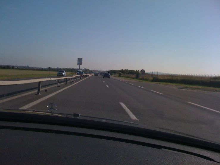 a freeway that has a lot of traffic and water tower