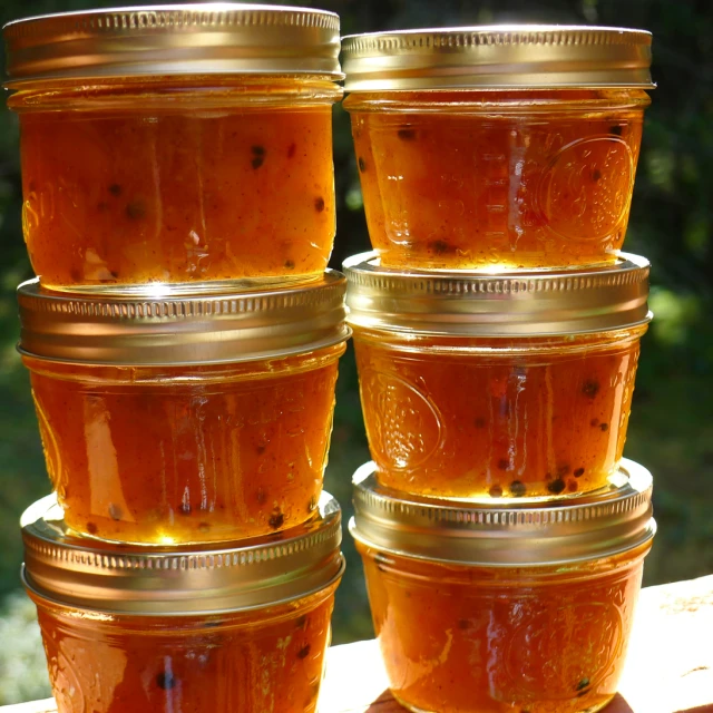 four jars are filled with different food items