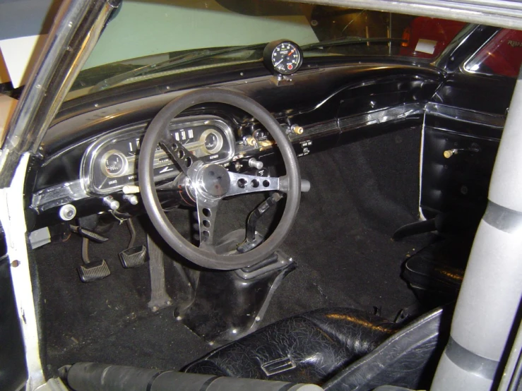 the inside of a vehicle with a steering wheel