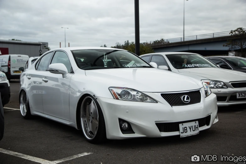 a white car that is parked in a lot