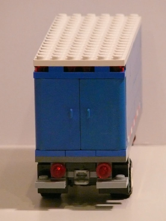a large toy truck has several lego blocks on it