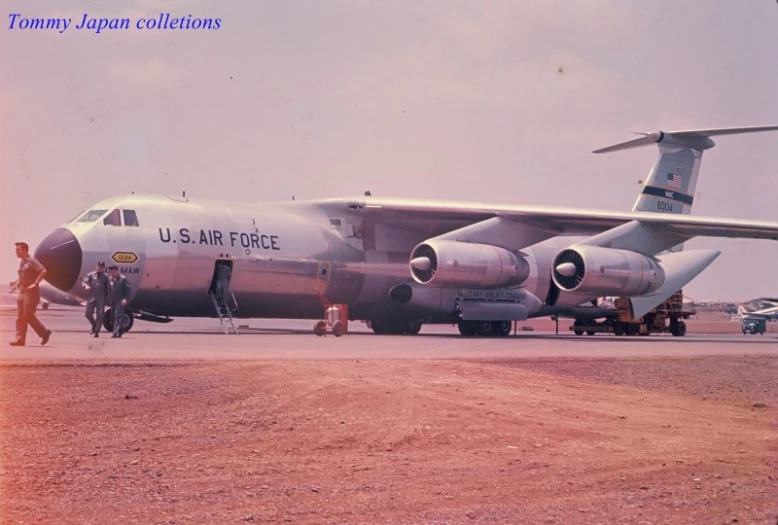 an airplane that is sitting on the dirt