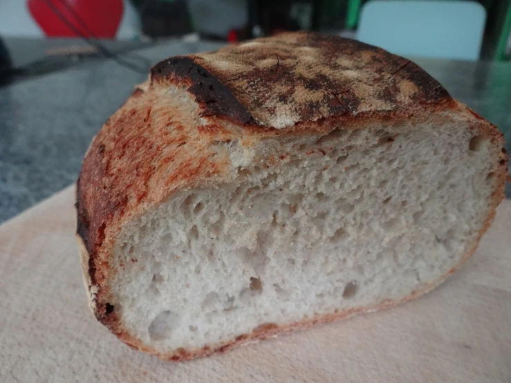 a loaf of bread that has been cut and baked