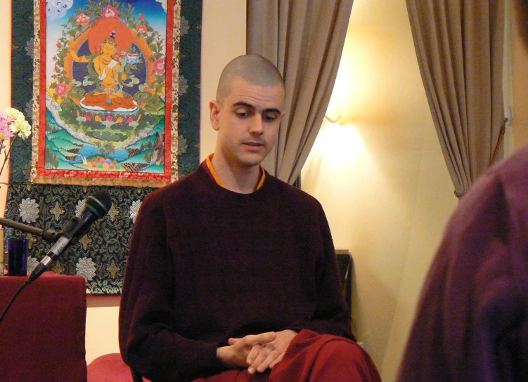 a monk is sitting in his meditation pose