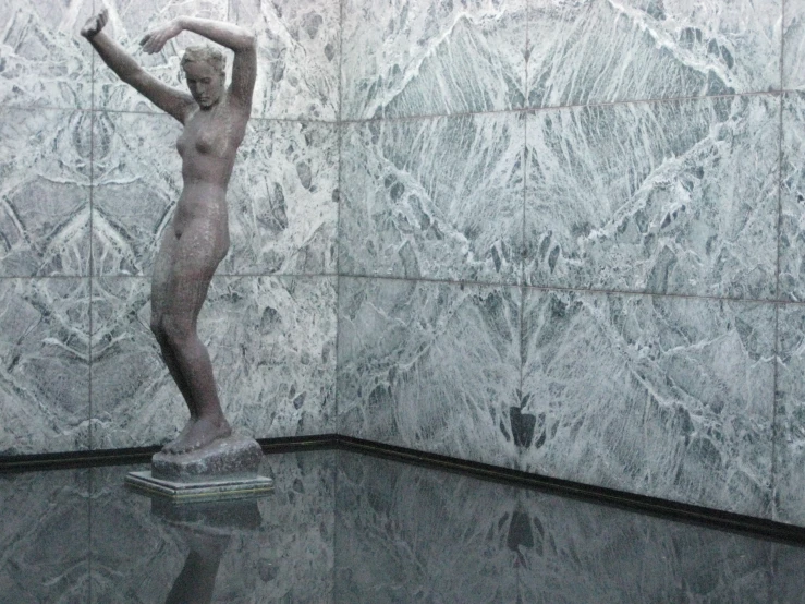 statue of a dancer in marble wall display