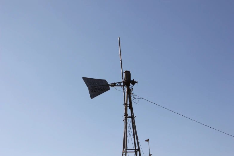 a small wind indicator is against the sky