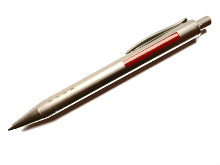 a ball pen that is sitting on a surface