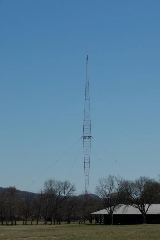 a large antenna structure sits in the middle of a field