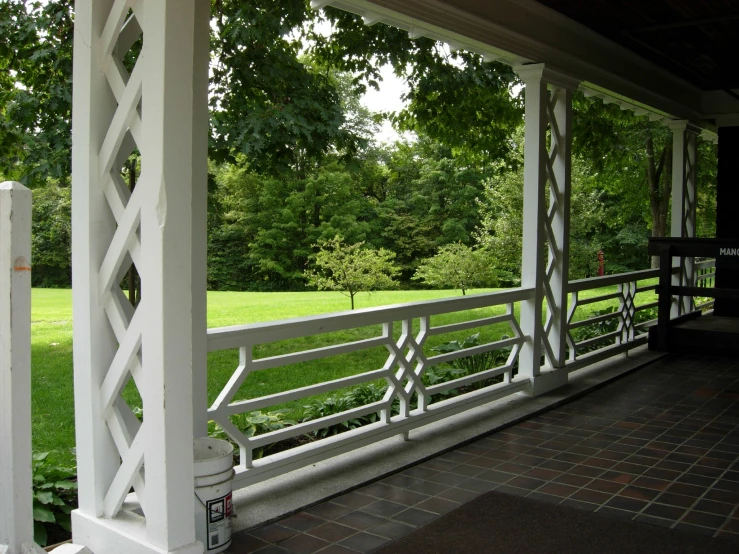 a close up view of an attached porch with columns