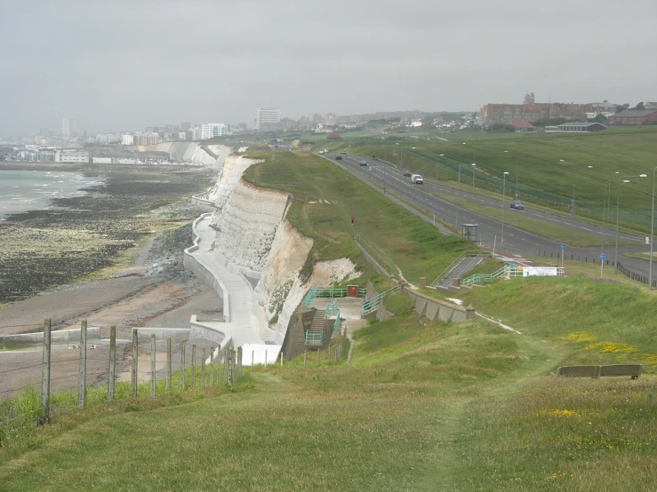 a view of a coastline from a hillside