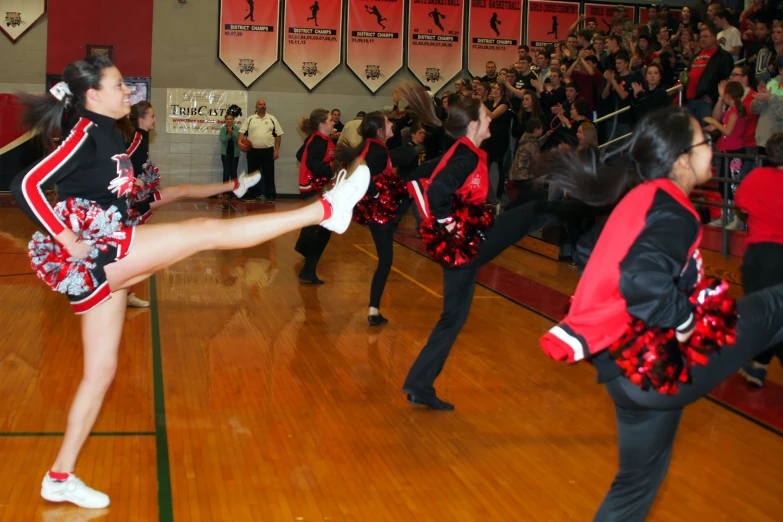 cheerleaders perform in a class at a high school