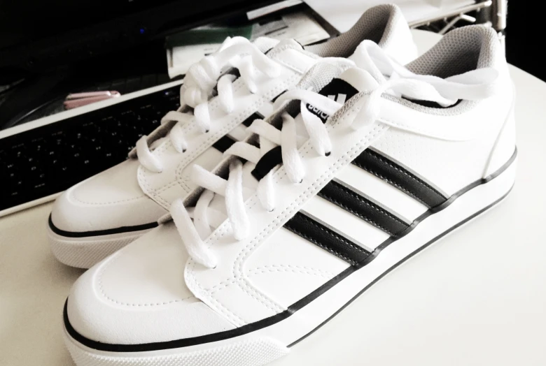 a black and white shoe on top of a desk