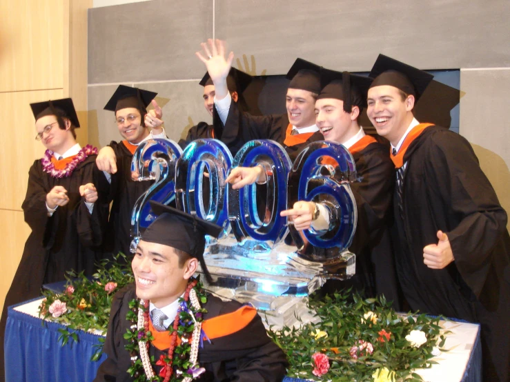 a group of graduates with their number seventy