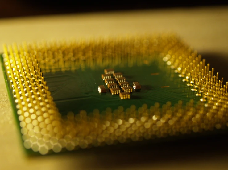 a green and yellow colored electronic device that looks like a circuit board