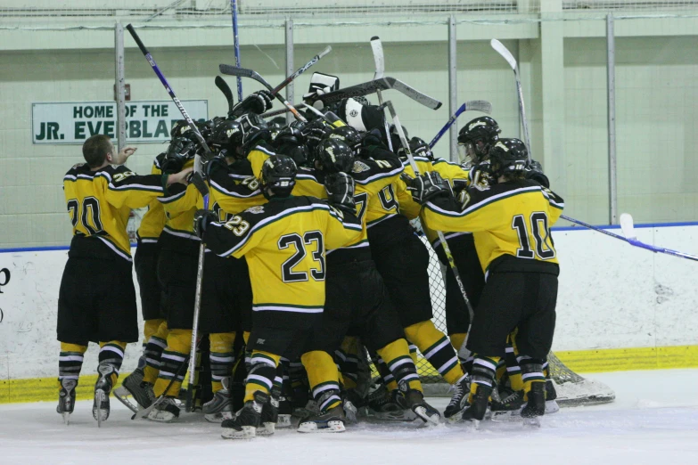 group of ice hockey players huddled together, during a huddle