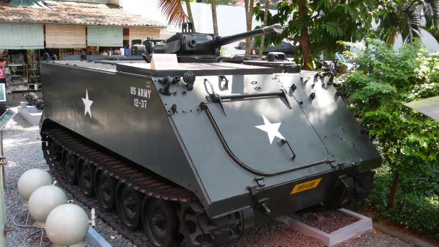 a large armored tank on display in a building