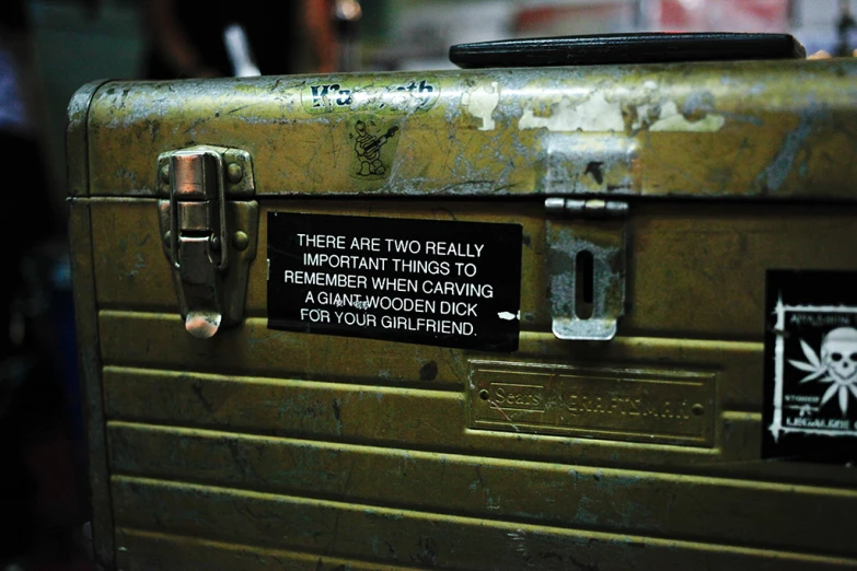 there is a sign attached to a suitcase