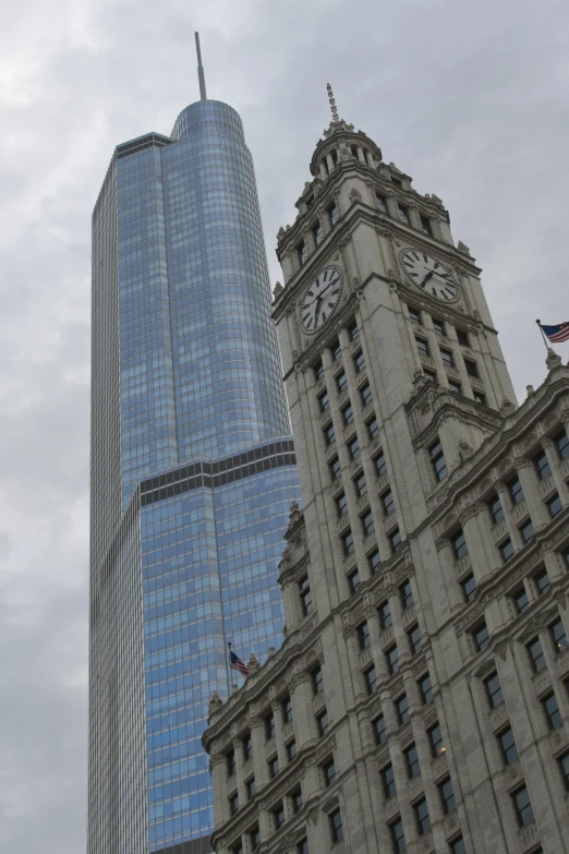 two tall buildings and clock on the side