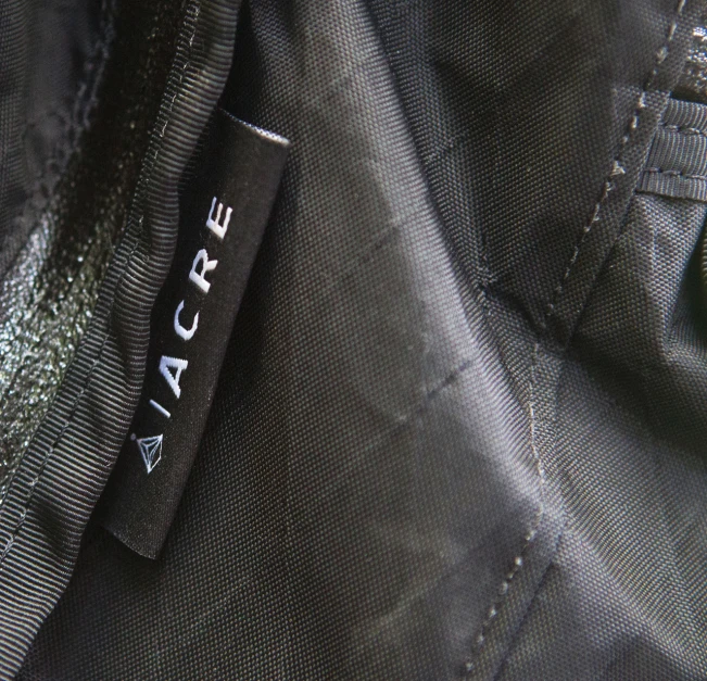 a tag that says'aiccre'on the side of a jacket