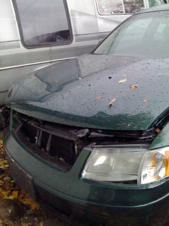 a damaged gray truck is in front of an suv